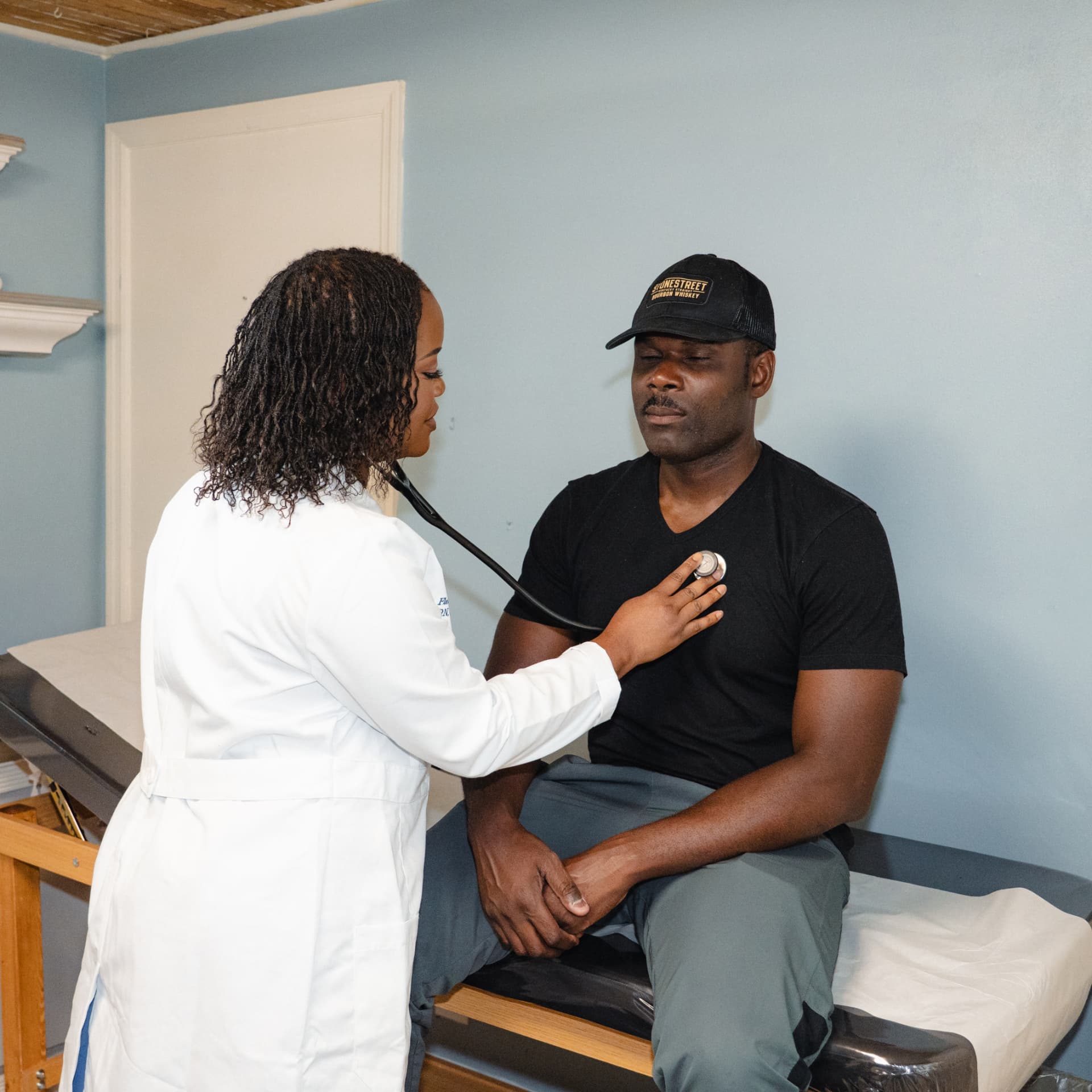 Provider examining a patient with a stethoscope